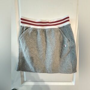 Champion grey mini skirt with red and white band. Size large.